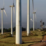 Wind turbines generating renewable energy, highlighting green transition efforts